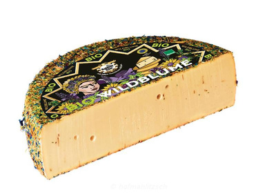Produktfoto zu Baldauf Wildblumenkäse - voll aromatisch mit bunten essbaren Blüten